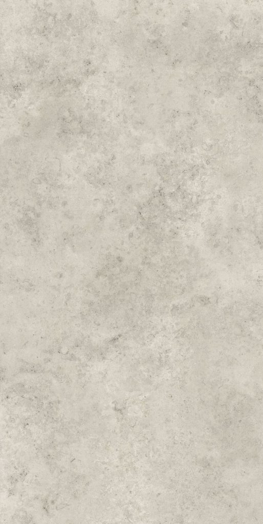 Bej ve gri tonlarında, doğal taş dokulu Lapidura Jura Beige porselen tezgah yüzeyi yakın çekim.
