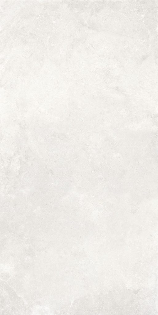 Doğal taş dokusuna sahip, fildişi ve açık bej tonlarındaki Lapidura Leccese Stone Ivory porselen tezgah yüzeyi.