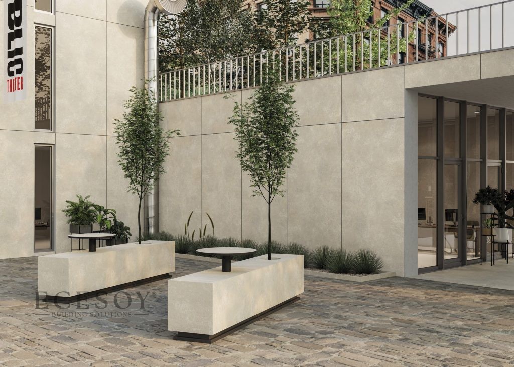 Bej limestone görünümlü Lapidura porselen levhalarla kaplanmış modern bina dış cephesi ve peyzaj elemanları.
