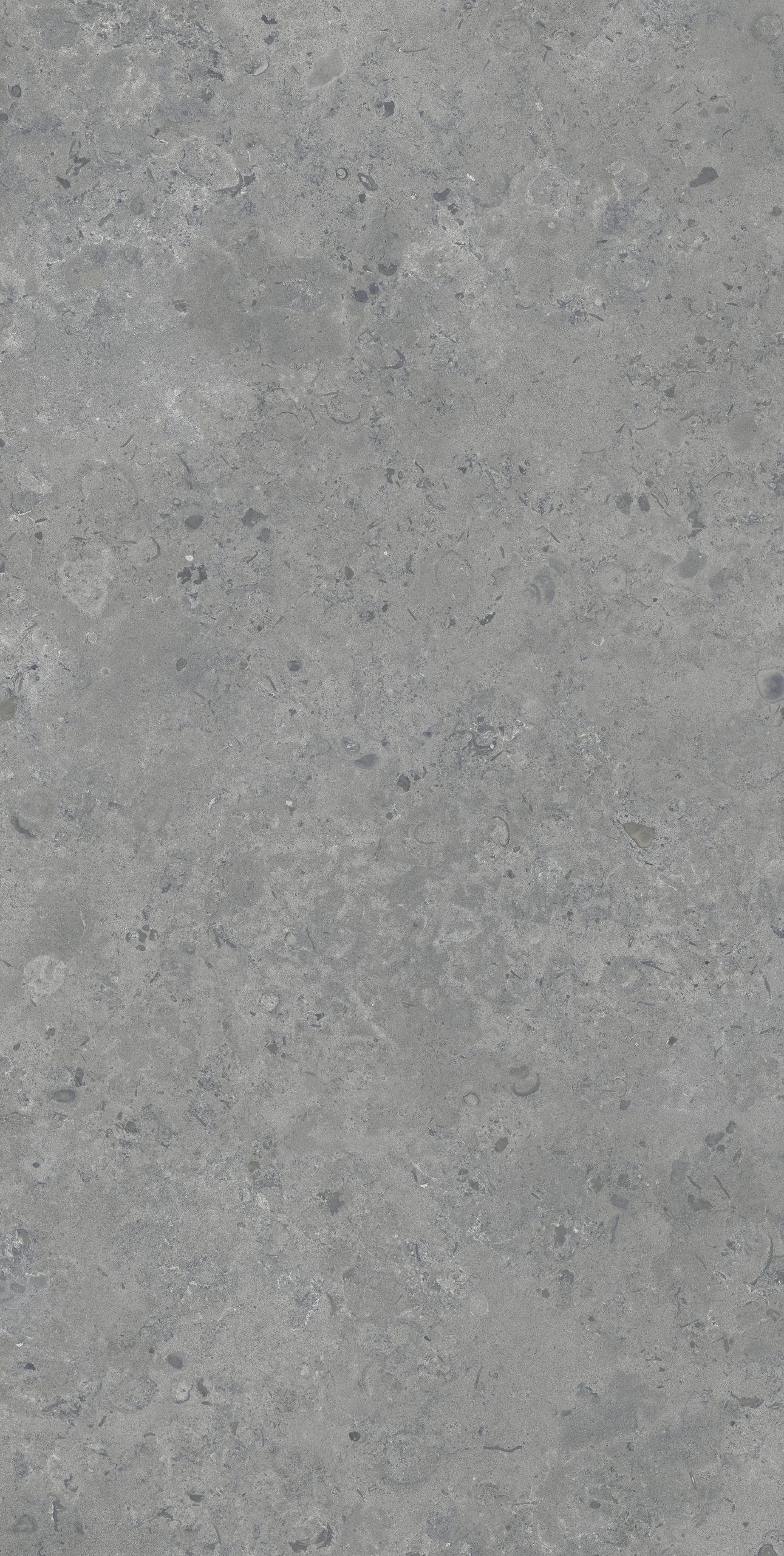 Gri tonlarda, doğal taş görünümlü Lapidura Norwegian Stone Grey porselen tezgah plakasının yakın plan doku detayı.